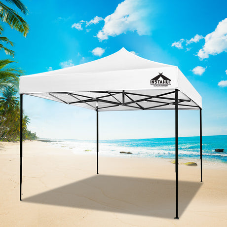 White pop up gazebo partly folded during set up