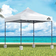 White 3 x 3 m pop up gazebo with four base pods set up outdoors