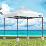 White 3 x 3 m pop up gazebo with four base pods set up outdoors