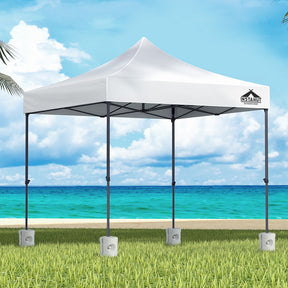 White 3 x 3 m pop up gazebo with four base pods set up outdoors