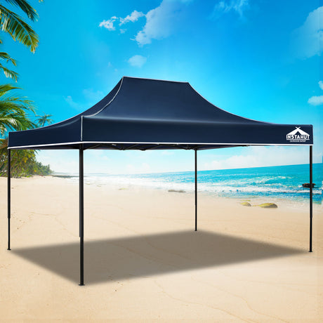 Navy pop up gazebo providing shade over an outdoor gathering