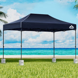 Navy 3 x 4.5 m pop up gazebo with four base pods set up outdoors