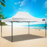 White pop up gazebo used as a shaded market stall with tables underneath