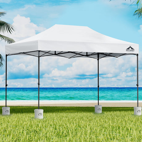 White 3 x 4.5 m pop up gazebo with four base pods set up outdoors
