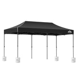 Long black folding marquee tent shown from the side with its peaked canopy