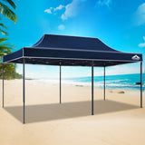 Navy pop up gazebo folded down to its compact size for transport
