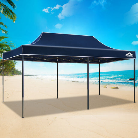 Navy pop up gazebo folded down to its compact size for transport
