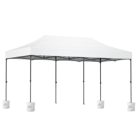 Long white folding marquee tent shown from the side with its peaked canopy