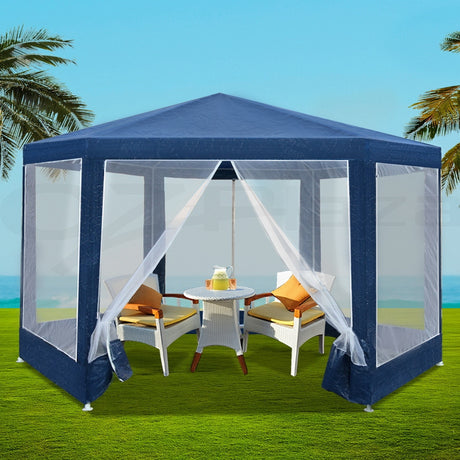 Navy hexagonal gazebo with mesh walls set up outdoors for a party
