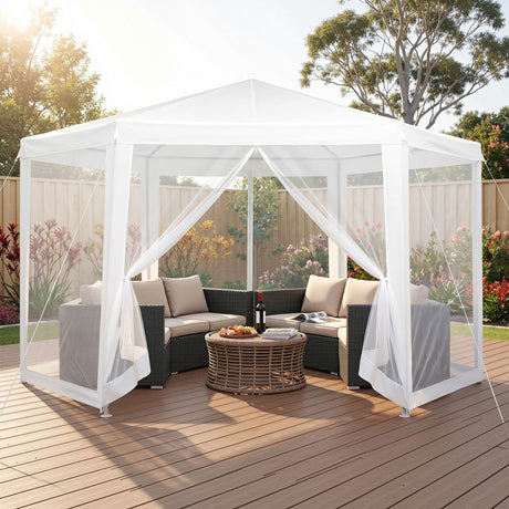 White hexagonal gazebo with mesh walls set up on grass for an outdoor party