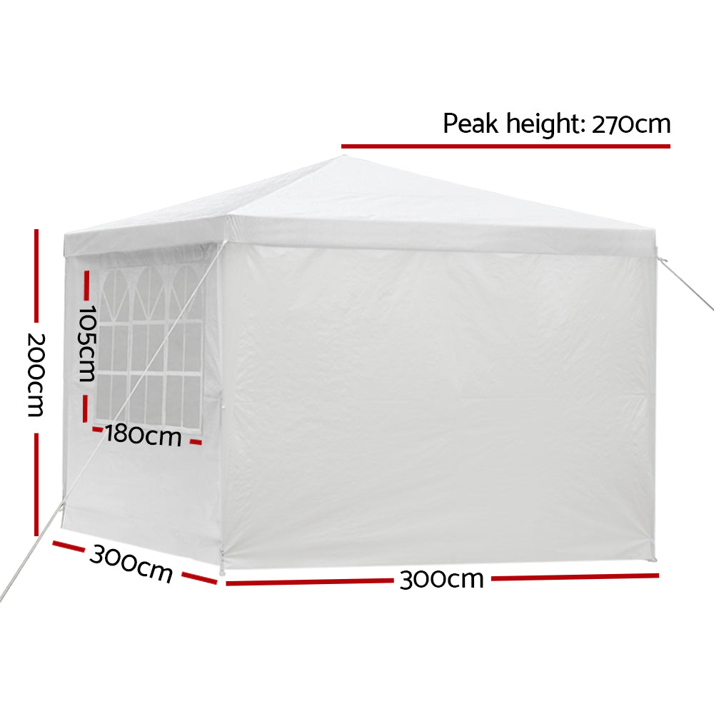 White marquee gazebo with zip door panel open showing the interior space