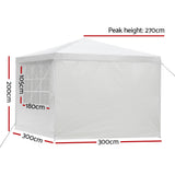 White marquee gazebo with zip door panel open showing the interior space