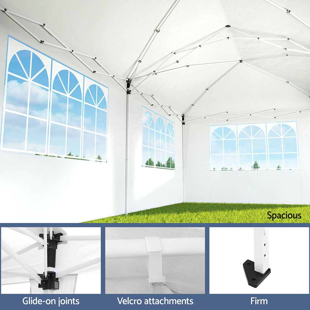 Side view of the white gazebo with wall panels rolled open for airflow
