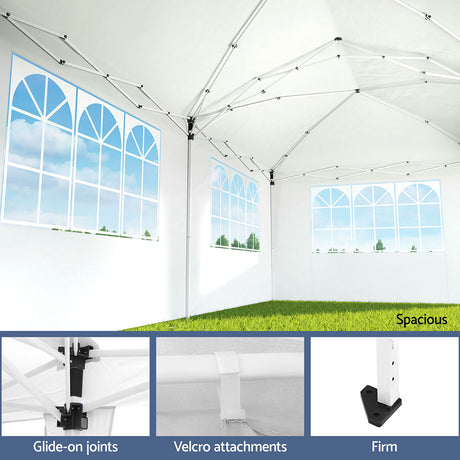 Side view of the white gazebo with wall panels rolled open for airflow