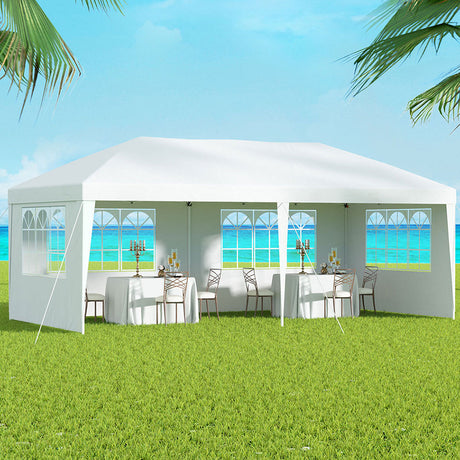 White 3 x 6 m pop up gazebo with four window side walls fitted around the frame
