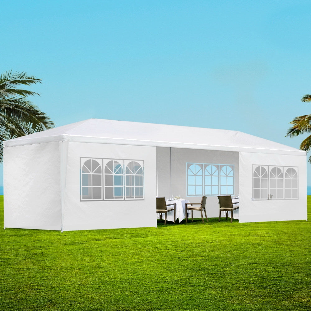 White 3 x 9 m marquee gazebo with eight side wall panels fitted