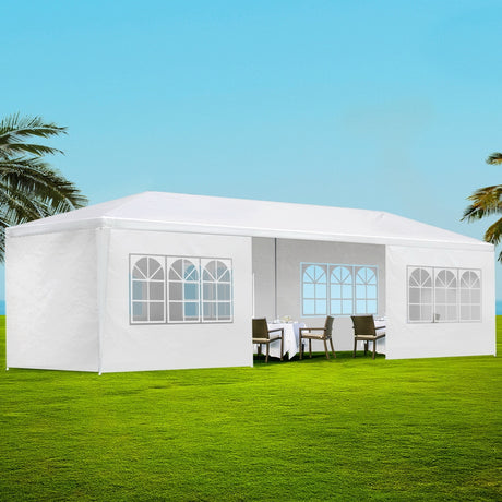 White 3 x 9 m marquee gazebo with eight side wall panels fitted