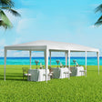 White 3 x 9 m wedding marquee gazebo with open sides set up outdoors