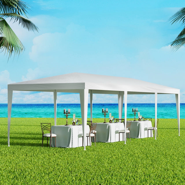 White 3 x 9 m wedding marquee gazebo with open sides set up outdoors