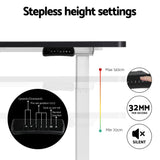 Manuka black electric standing desk with white frame in a home office