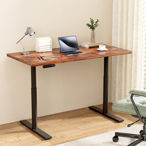 Braddon rustic brown electric standing desk with black frame in a home office