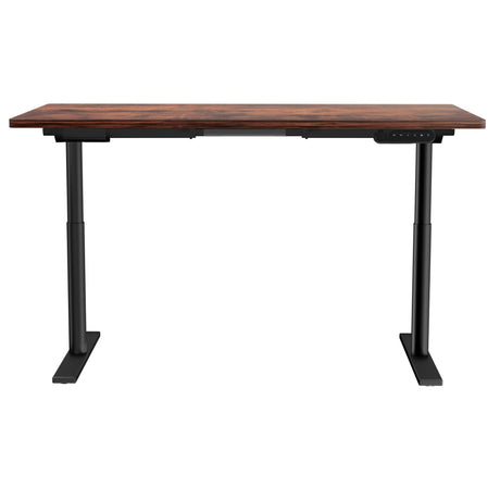 Braddon rustic brown electric standing desk with black frame in a home office