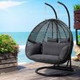 Nahuel grey rattan pod swing chair with cushion on twin pole steel frame