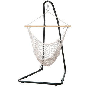 Aruba cream cotton rope hammock chair with wooden spreader bars and steel stand in a garden