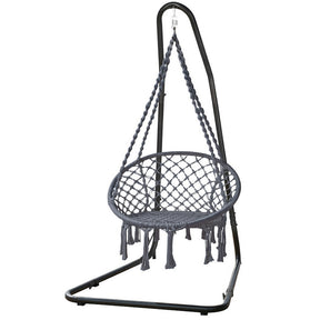 Nevis grey tasselled hammock chair with padded seat and powder coated steel stand in a backyard
