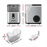 Silver nugget ice maker on a kitchen benchtop beside a glass of ice