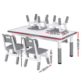 Children's adjustable table and chairs with draw-on top
