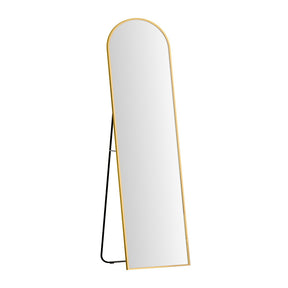 Grey River gold arched full length floor mirror in a bedroom
