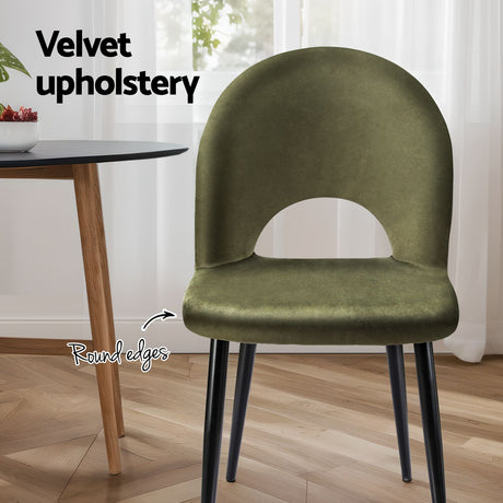Ebenezer green velvet dining chair in a modern dining room