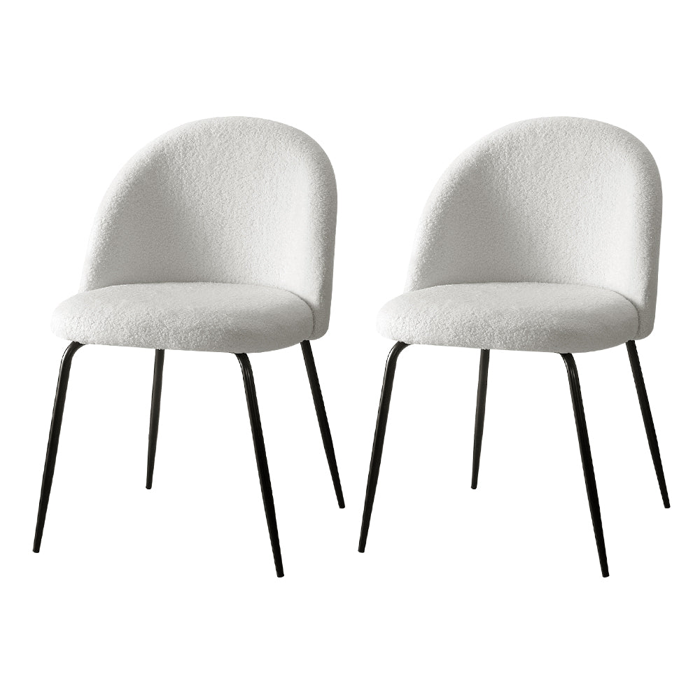 Angaston white sherpa winged dining chairs, set of two, with steel legs in a dining room