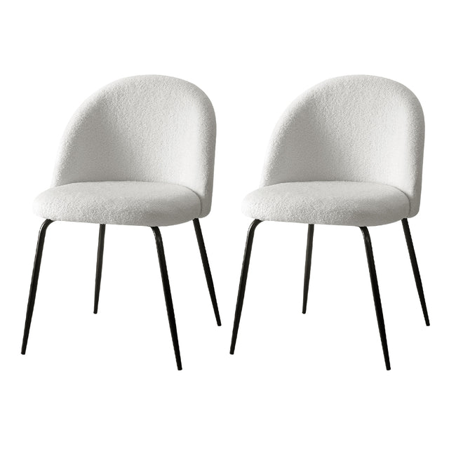 Angaston white sherpa winged dining chairs, set of two, with steel legs in a dining room