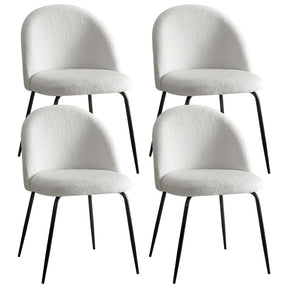 Charleston white sherpa boucle winged dining chairs with powder coated steel legs in a dining room