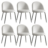Hahndorf white sherpa winged dining chairs with steel legs around a dining table