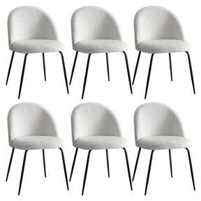 Hahndorf white sherpa winged dining chairs with steel legs around a dining table