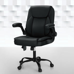 Hakodate black faux leather mid back massage office chair in a home office