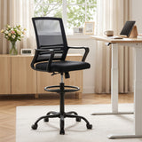 Northcliffe black mesh drafting chair with foot ring at a standing desk