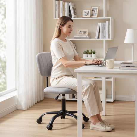 Pingelly grey armless fabric office chair in a small home office