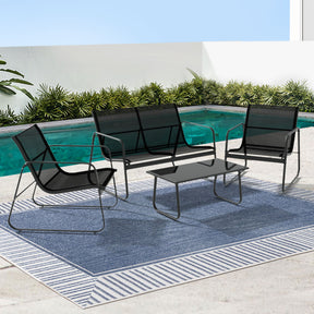 Currambene black outdoor sofa set with Textilene seating and a glass top table on a patio