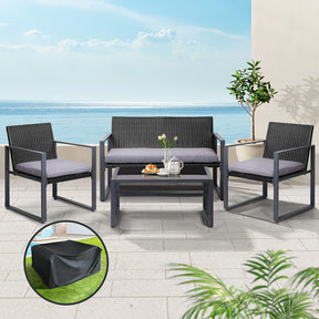 Sussex Inlet black rattan outdoor sofa set with tempered glass table on a patio