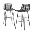 Rosebud West black outdoor wicker bar stool with steel frame on a patio