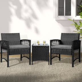 Greenwell Point wicker outdoor bistro set with two chairs and a glass top table on a deck