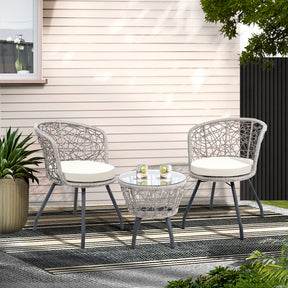 Woollamia rattan outdoor bistro set with two round chairs and a glass top side table
