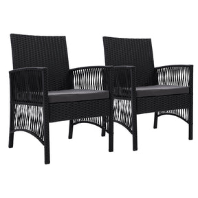 Bomaderry black wicker outdoor lounge chairs with foam cushions on a patio