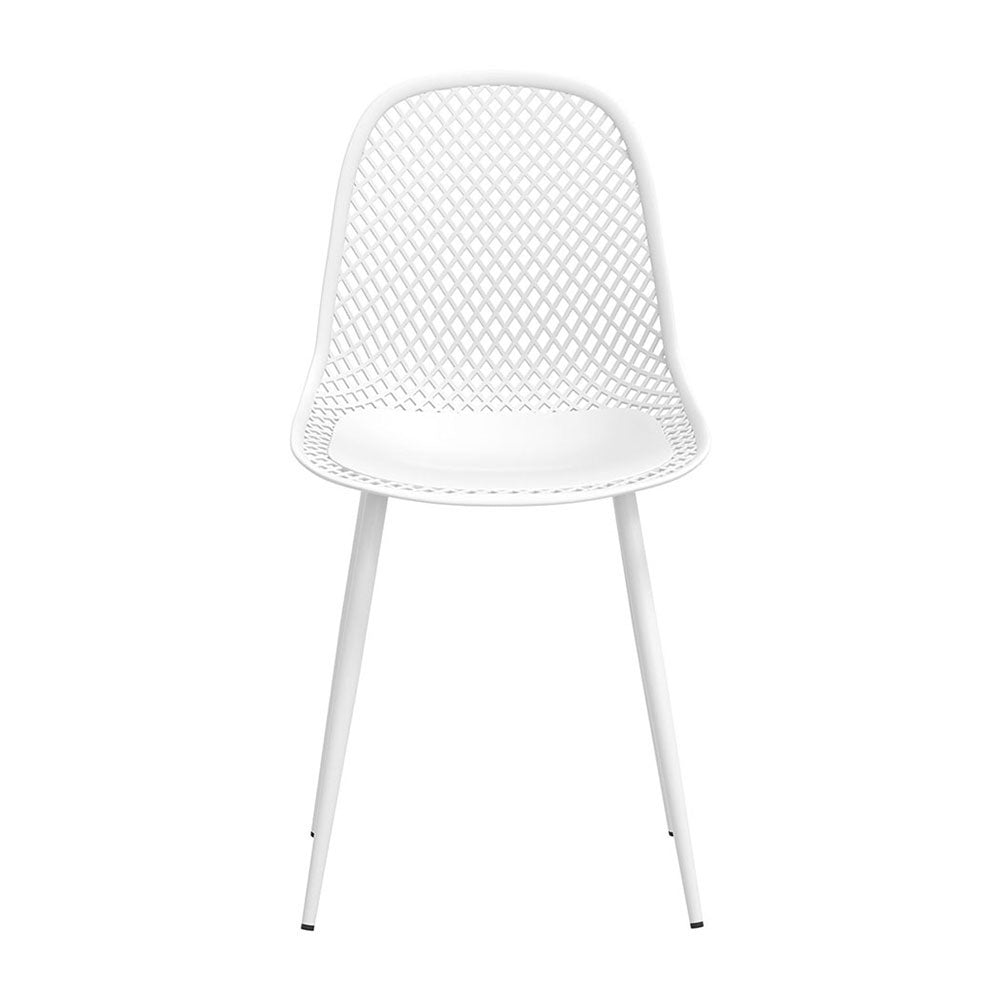 Hyams Beach set of four white polypropylene outdoor dining chairs on a patio