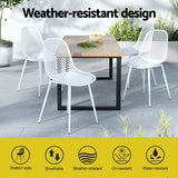 Hyams Beach set of four white polypropylene outdoor dining chairs on a patio
