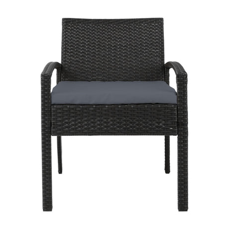 Ulladulla pair of black PE wicker outdoor dining chairs with cushions on a patio